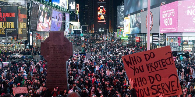 Demonstrators gather during a protest in Times Square on Saturday, Jan. 28, 2023, in New York, in response to the death of Tyre Nichols.