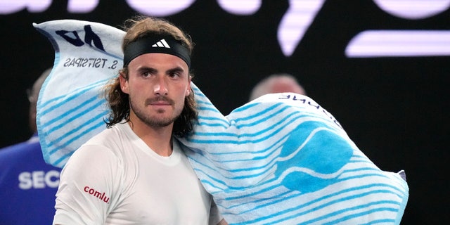 Stefanos Tsitsipas of Greece reacts as he changes ends during his men's singles final match against Novak Djokovic of Serbia at the Australian Open tennis championship in Melbourne, Australia, Sunday, Jan. 29, 2023. 