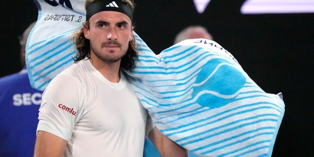 Stefanos Tsitsipas of Greece reacts as he changes ends during his men's singles final match against Novak Djokovic of Serbia at the Australian Open tennis championship in Melbourne, Australia, Sunday, Jan. 29, 2023.