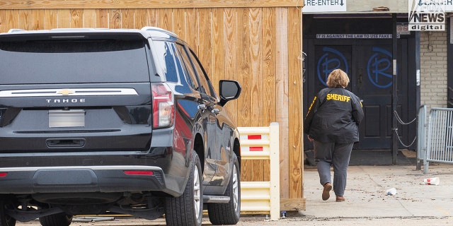 Investigators are seen outside of  Reggie’s bar in Baton Rouge, Louisiana on Tuesday, January 24, 2023. The bar is reportedly one of the last places where LSU student, Madison Morgan was seen before her death on January 15.