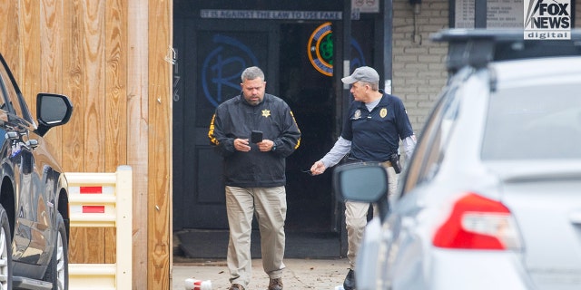 Investigators are seen outside of  Reggie’s bar in Baton Rouge, Louisiana on Tuesday, January 24, 2023. The bar is reportedly one of the last places where LSU student, Madison Morgan was seen before her death on January 15.