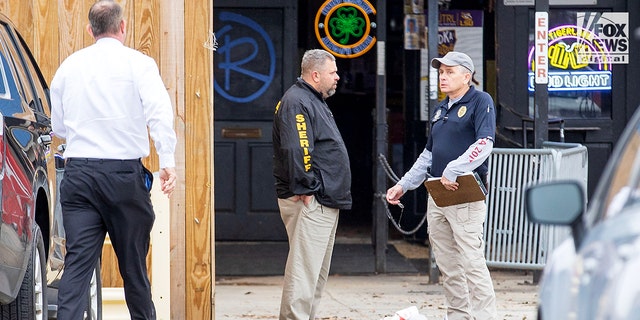 Investigators are seen outside of Reggie’s bar in Baton Rouge, Louisiana on Tuesday, Jan. 24, 2023. The bar is reportedly one of the last places where LSU student Madison Brooks was seen before her death on Jan. 15.
