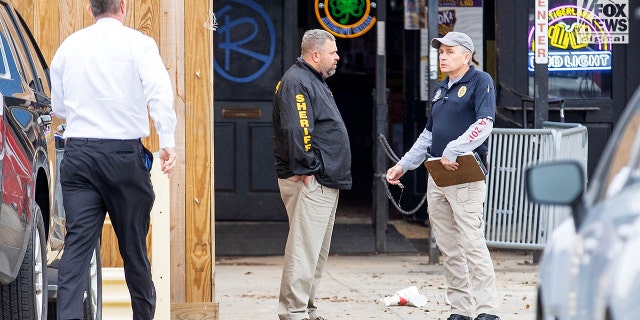 Investigators are seen outside of Reggie’s bar in Baton Rouge, Louisiana on Tuesday, Jan. 24, 2023. The bar is reportedly one of the last places where LSU student Madison Brooks was seen before her death on Jan. 15.