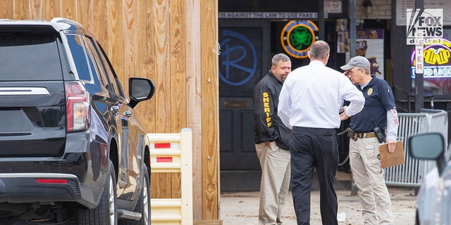 Investigators are seen outside of Reggie’s bar in Baton Rouge, Louisiana, on Tuesday, January 24, 2023. The bar is reportedly one of the last places where LSU student Madison Brooks was seen before her death on January 15.