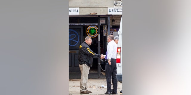 Investigators are seen outside of  Reggie’s bar in Baton Rouge, Louisiana on Tuesday, January 24, 2023. The bar is reportedly one of the last places where LSU student, Madison Morgan was seen before her death on January 15.