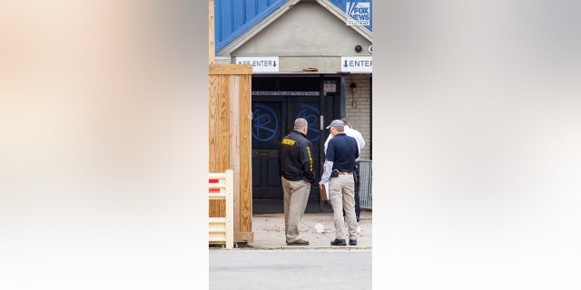Investigators are seen outside of Reggie’s bar in Baton Rouge, Louisiana on Tuesday, Jan. 24, 2023. The bar is reportedly one of the last places where LSU student Madison Brooks was seen before her death on Jan. 15.