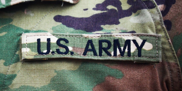 The U.S. Army insignia can be seen on the uniform of U.S. soldiers.