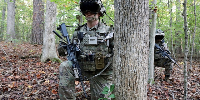 Soldiers wear a prototype of the U.S. Army's Integrated Visual Augmentation System during a Soldier Touchpoint 3 squad reconnaissance mission test training event at Fort Pickett, Va., Oct. 21, 2020.