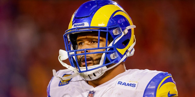 Aaron Donald #99 of the Los Angeles Rams walks off the field after a defensive interception in the fourth quarter against the Kansas City Chiefs at Arrowhead Stadium on November 27, 2022 in Kansas City, Missouri.