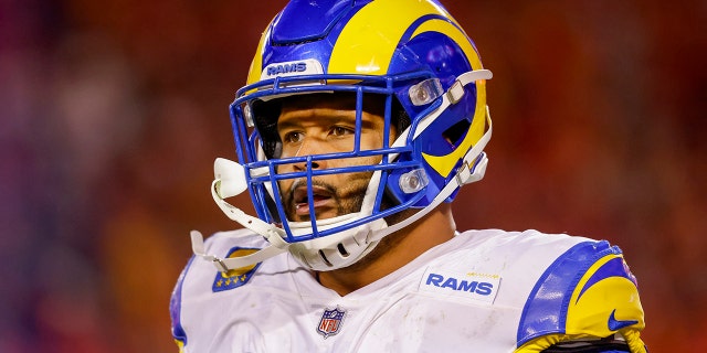 Aaron Donald #99 of the Los Angeles Rams walks off the field after a defensive interception in the fourth quarter against the Kansas City Chiefs at Arrowhead Stadium on November 27, 2022 in Kansas City, Missouri.