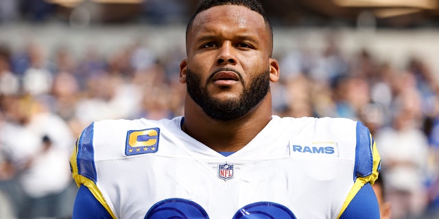 Aaron Donald #99 of the Los Angeles Rams looks on during the national anthem prior to an NFL football game against the Dallas Cowboys at SoFi Stadium on October 09, 2022 in Inglewood, California.