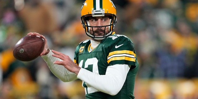 Aaron Rodgers, number 12 of the Green Bay Packers, warms up before the game against the Detroit Lions at Lambeau Field on January 8, 2023 in Green Bay, Wisconsin.