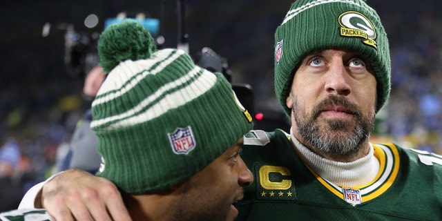 Green Bay Packers quarterback Aaron Rodgers, #12, and Green Bay Packers wide receiver Randall Cobb, #18, walk off the field after a game between the Green Bay Packers and the Detroit Lions at Lambeau Field on Jan. 8, 2023 in Green Bay, Wisconsin.