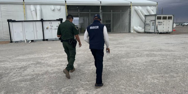 NYC Mayor Eric Adams visits a CBP processing facility. 