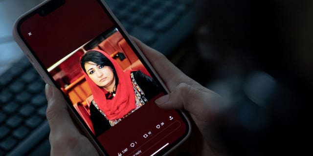 A picture of former Afghan lawmaker Mursal Nabizada on a mobile phone, who was shot dead by gunmen last night at her house in Kabul on Jan. 15, 2023.
