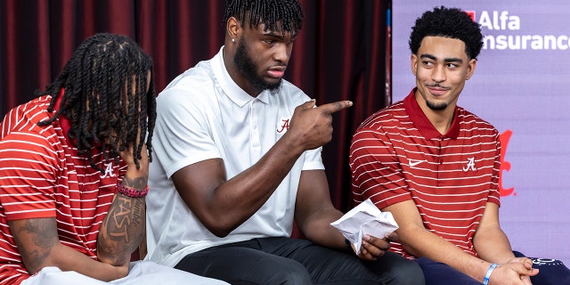 Alabama players, from left, Jahmyr Gibbs, Will Anderson Jr. and Bryce Young wait to speak at the podium before they declared for the NFL Draft, Monday, Jan. 2, 2023, in Tuscaloosa.
