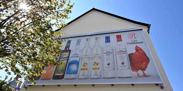 A banner with products from Nordbrand Nordhausen hangs in Germany. Authorities in the country want to put more restrictions on advertising alcohol, sports gambling, and tobacco.