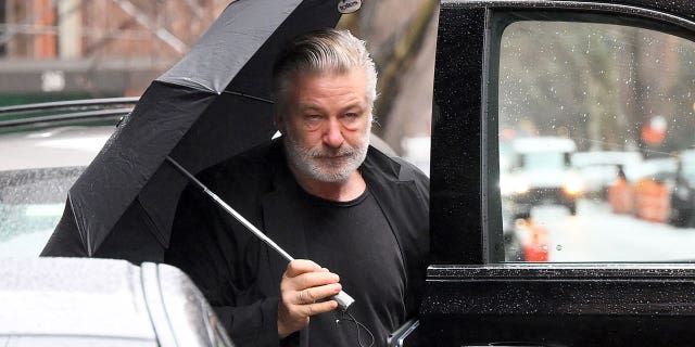Alec Baldwin arriving home on Monday, after he was charged with two counts of involuntary manslaughter.