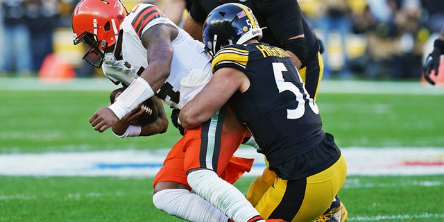 Cleveland Browns quarterback Deshaun Watson is sacked by Pittsburgh Steelers linebacker Alex Highsmith (56) during the second half of an NFL football game in Pittsburgh, Sunday, Jan. 8, 2023.