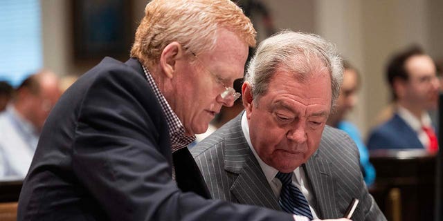Alex Murdaugh and defense attorney Dick Harpootlian review evidence during his trial for murder at the Colleton County Courthouse on Tuesday, January 31, 2023. 