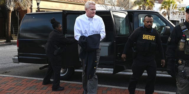 Alex Murdaugh is led into the Colleton County Courthouse in Walterboro, South Carolina, Jan. 23, 2023 for the first day of jury selection in his murder trial.