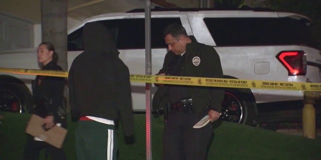 Police respond to a shooting in Los Angeles' Beverly Crest neighborhood that reportedly left three dead and four injured early Saturday, Jan. 28, 2022. 