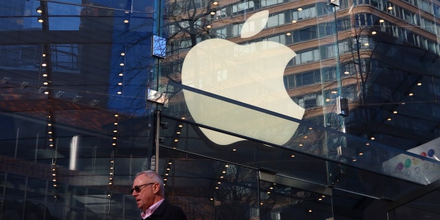 An Apple logo is displayed in the window of their Upper West Side store on Dec. 21, 2022, in New York City. 