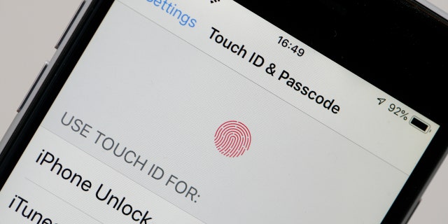 In this photo illustration, a settings page using ID Touch is displayed on the screen of an iPhone on February 7, 2019 in Paris.