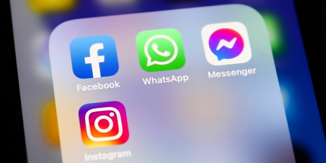 Facebook, WhatsApp, Messenger and Instagram icons displayed on a phone screen are seen in this illustration photo taken in Krakow, Poland, April 6, 2022. 