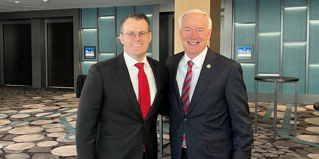 Former Republican Gov. Asa Hutchinson of Arkansas (right) teams up with newly inaugurated Iowa Lt. Gov. Adam Gregg, on Friday Jan. 13, 2023 in Des Moines Iowa