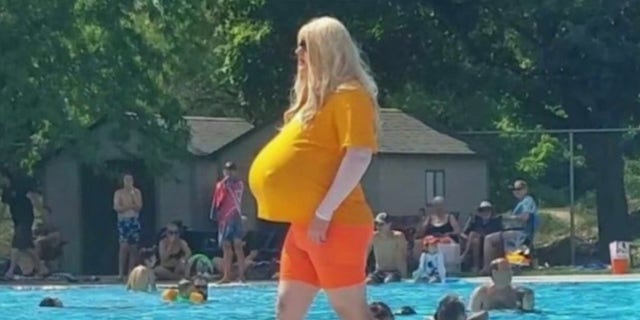 The trans teacher sparking international headlines was spotted wearing huge prosthetic breasts at the pool. 