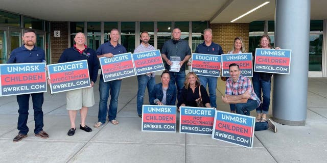 Members of education activism group Awake Illinois pose at event. Photo provided by Shannon Adcock, president and founder of Awake Illinois.