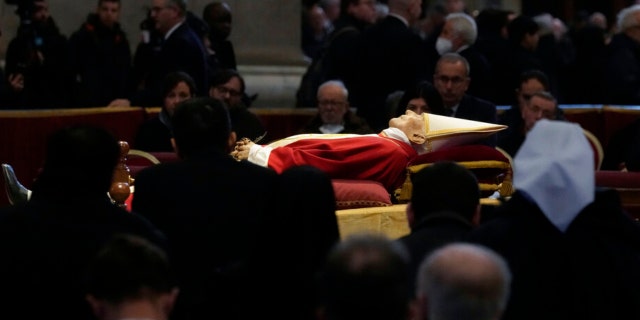 The body of late Pope Emeritus Benedict XVI is lied out in state inside St. Peter's Basilica at The Vatican, Wednesday, Jan. 4, 2023.