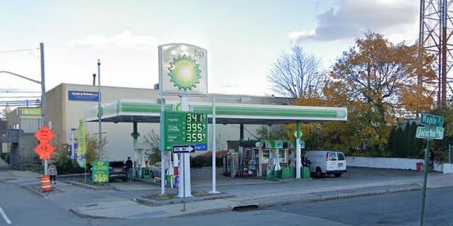 A Google Earth image shows the exterior of a BP gas station in Mineola, N.Y. where a woman's Range Rover was stolen with her dog inside.