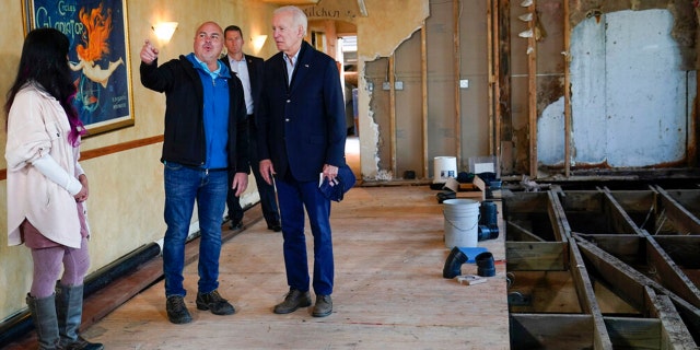 President Joe Biden talks with Paradise Beach Grille co-owners Chuck Maier and Ally Gotlieb, left, as he visitswith business owners and local residentsin Capitola,Calif., Thursday, Jan 19, 2023,to survey recovery efforts following a series of severe storms. 