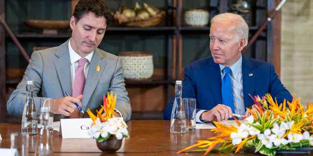 President Joe Biden looks to Canadian Prime Minister Justin Trudeau during a meeting of G7 and NATO leaders in Bali, Indonesia