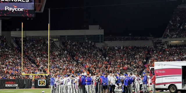 Buffalo Bills players pray for teammate Damar Hamlin during the first half of an NFL football game against the Cincinnati Bengals, Monday, Jan. 2, 2023, in Cincinnati.  The game was postponed after Buffalo Bills' Damar Hamlin collapsed, NFL Commissioner Roger Goodell announced.