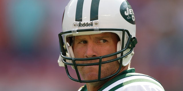 New York Jets quarterback Brett Favre, #4, warms up before the game against the New England Patriots at Giants Stadium.