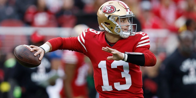 San Francisco 49ers quarterback Brock Purdy (13) passes against the Arizona Cardinals during the second half of an NFL football game in Santa Clara, California on Sunday, January 8, 2023. 