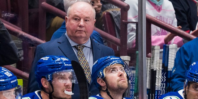 Canucks head coach Bruce Boudreau in the dugout against the Carolina Hurricanes at Rogers Arena in Vancouver on October 24, 2022.