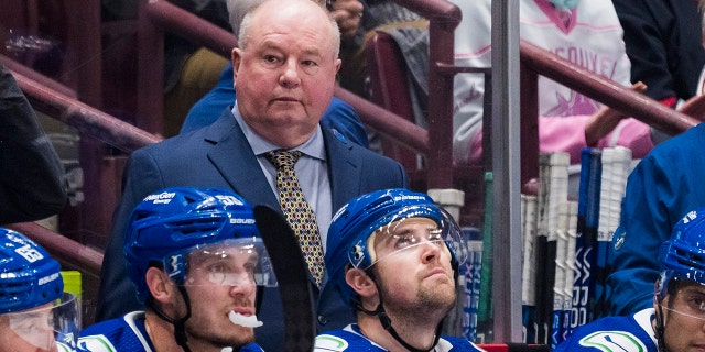 Canucks head coach Bruce Boudreau in the dugout against the Carolina Hurricanes at Rogers Arena in Vancouver on October 24, 2022.