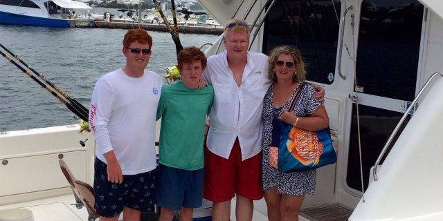 From left, Buster, Paul, Alex and Maggie Murdaugh pose together on a fishing boat.