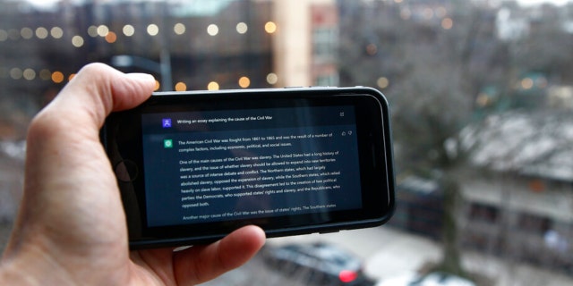 A ChatGPT prompt is shown on a device near a public school in Brooklyn, New York, Thursday, Jan. 5, 2023. New York City school officials started blocking this week the impressive but controversial writing tool that can generate paragraphs of human-like text. 