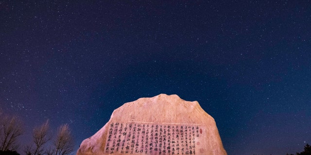 The Quadrantid meteor shower is seen above a park in Yantai, East China's Shandong Province, in the early morning of Jan. 4, 2022. 