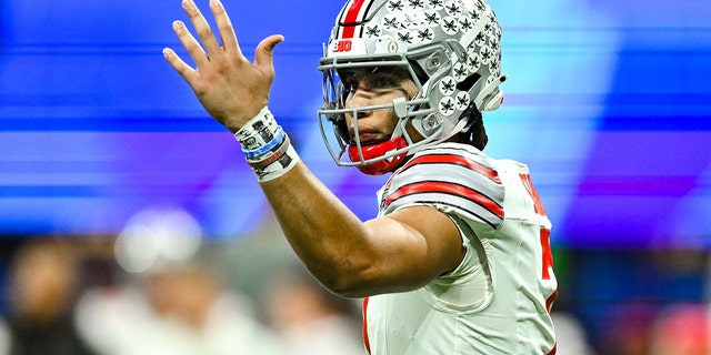 Ohio State quarterback C.J. Stroud (7) gestures during the Chick-fil-A Peach Bowl college football playoff game between the Ohio State Buckeyes and the Georgia Bulldogs on December 31, 2022 at Mercedes-Benz Stadium in Atlanta.
