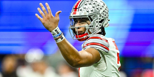 Ohio State quarterback C.J. Stroud (7) gestures during the Chick-fil-A Peach Bowl college football playoff game between the Ohio State Buckeyes and the Georgia Bulldogs on December 31, 2022 at Mercedes-Benz Stadium in Atlanta.