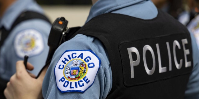 Chicago police officers in the West Englewood neighborhood of Chicago on Aug. 11, 2022. 