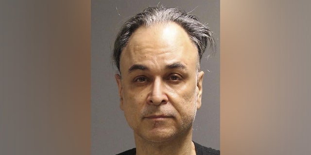 This photo provided by the Philadelphia Police Department shows Gary Cabana, who was arrested at a Philadelphia bus terminal early Tuesday, March 15, 2022, after setting his hotel room on fire, police said. Cabana is suspected of stabbing two workers at New York’s Museum of Modern Art and making threats regarding former President Donald Trump.