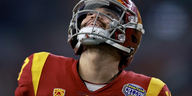 Caleb Williams of the USC Trojans reacts after a successful pass against the Tulane Green Wave during the Goodyear Cotton Bowl Classic on January 2, 2023.