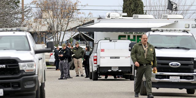 GOSHEN, CA - JANUARY 16: Tulare County Sheriff crime unit investigates the scene where six people, including a 6-month-old baby, her teenage mother and an elderly woman, were killed in a Central Valley farming community in what the local sheriff said was likely a targeted attack by a drug cartel on Monday, Jan. 16, 2023 in Goshen, CA. The massacre occurred around 3:30 a.m. in and around a residence in the Tulare County town of Goshen near Visalia. (Gary Coronado / Los Angeles Times via Getty Images)